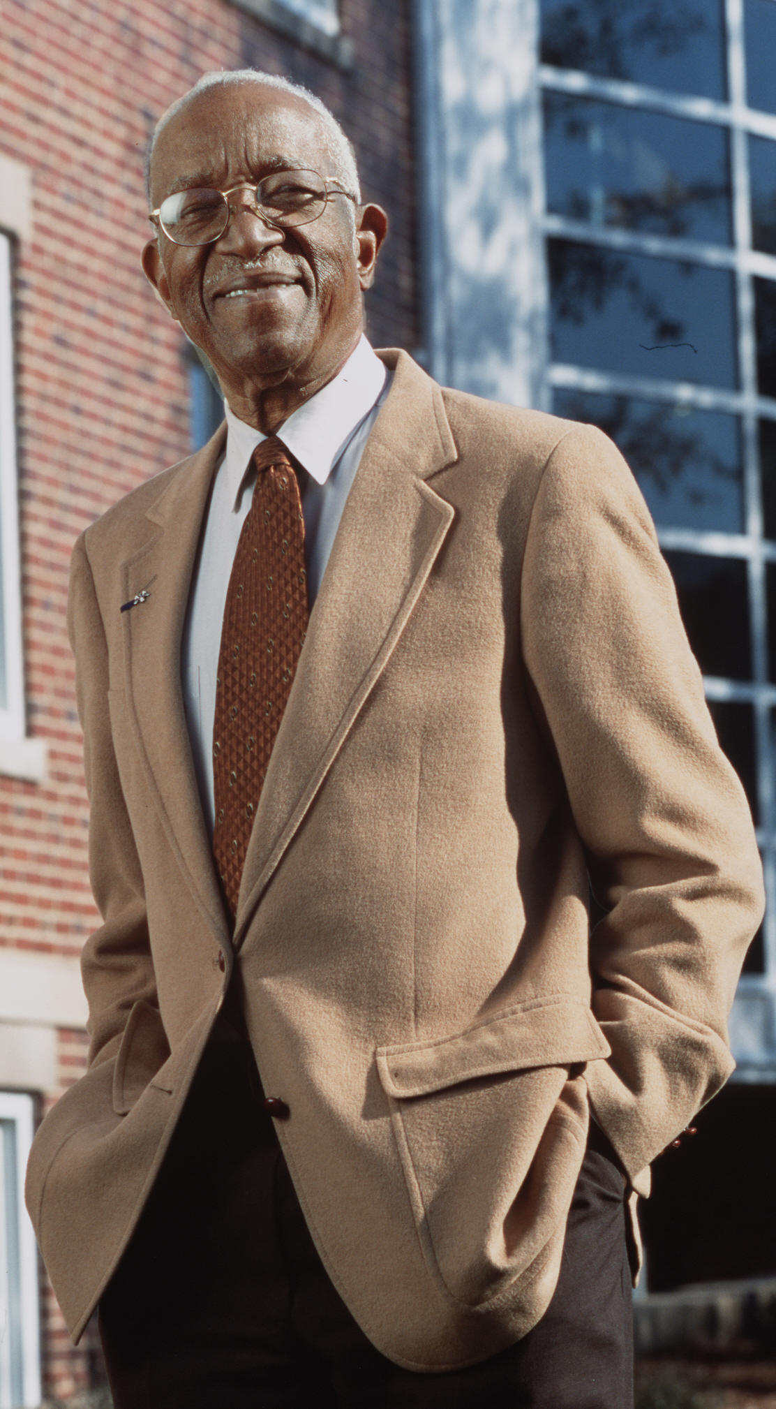 Dr. John Hope Franklin in front of John Hope Franklin Center for Interdisciplinary and International Studies